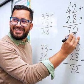 Teacher working at a whiteboard
