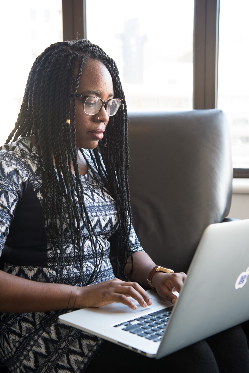 A federal employee at her laptop, working through her long resume